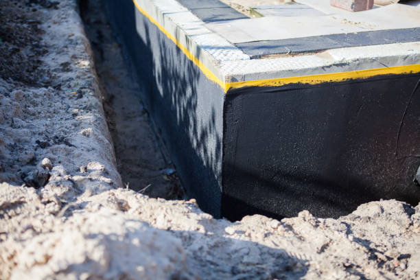 Professional Waterproofing technician working in Laurel, VA